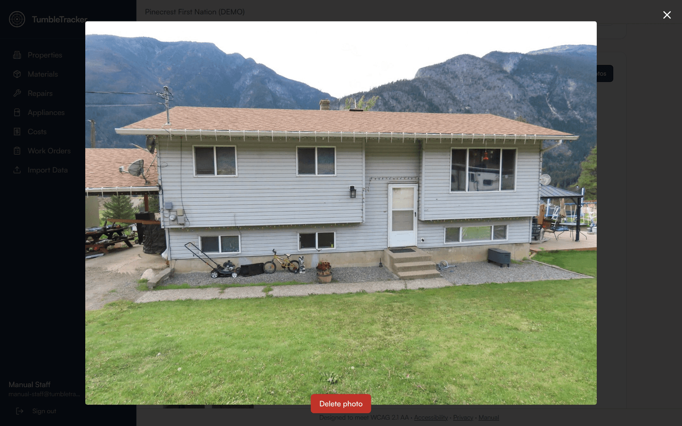A property photo opened full size over a dimmed TumbleTracker screen, with a close × at the top right and a red Delete photo button below the picture