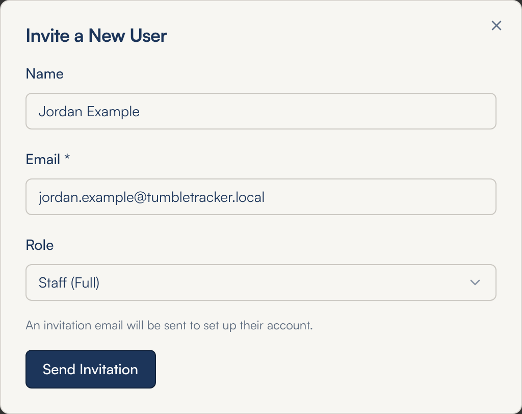The Invite a New User window with Name Jordan Example, Email jordan.example@tumbletracker.local, Role set to Staff (Full), the line An invitation email will be sent to set up their account, and a Send Invitation button